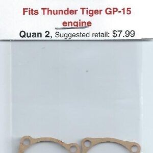 A pair of copper gaskets for the engine of an older model car.