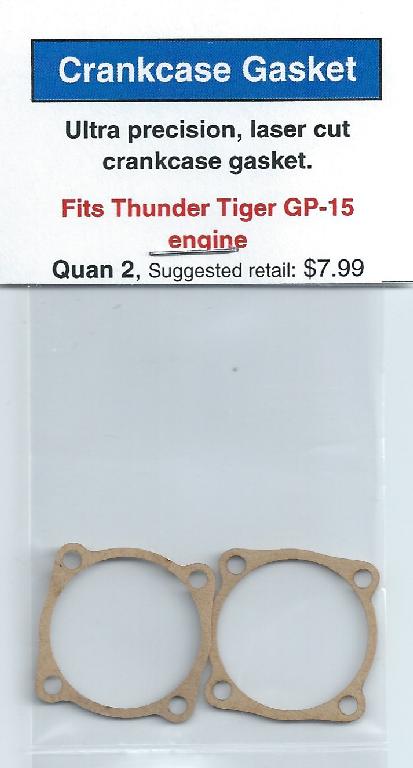 A pair of copper gaskets for the engine of an older model car.