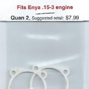 A pair of white plastic rings with the words " enya 1 5-3 engine ".