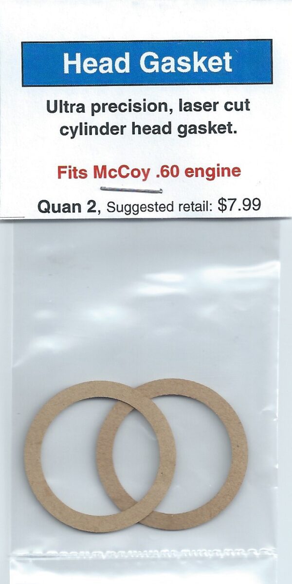 A pair of paper gaskets for mccoy engine.