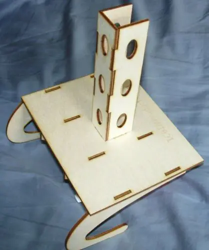 A wooden tower with holes for the top.