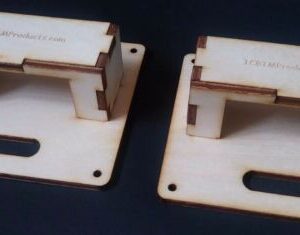 Two wooden blocks are sitting on a table.