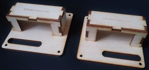 Two wooden blocks are sitting on a table.