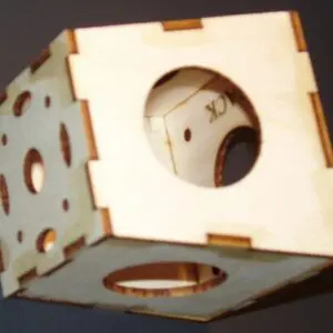 A wooden cube with a hole in the middle.