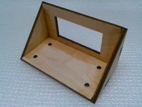 A small wooden frame with a mirror on it.