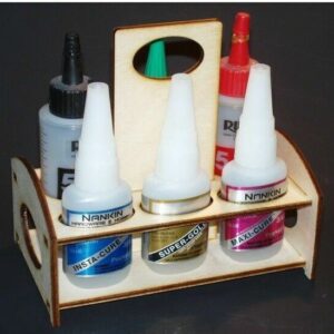 A wooden holder with several bottles of glue.